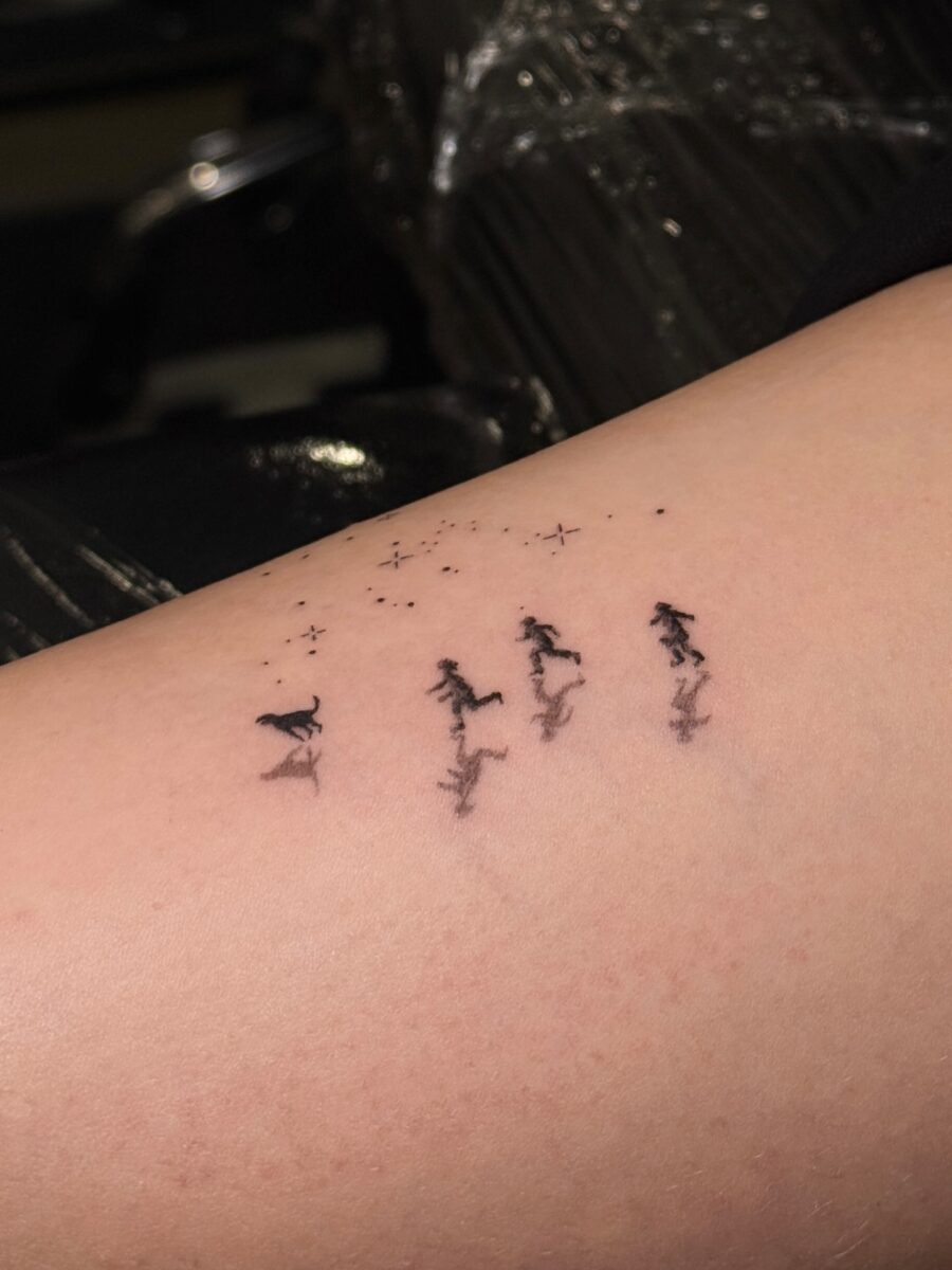Elegant Tattoo of Running Figures with Stars Tattoo on skin
