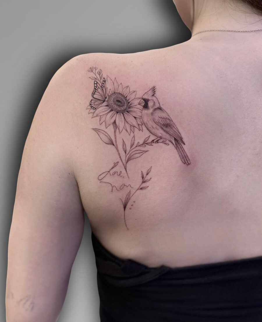 Elegant tribute tattoo featuring a bird and sunflower Tattoo on skin