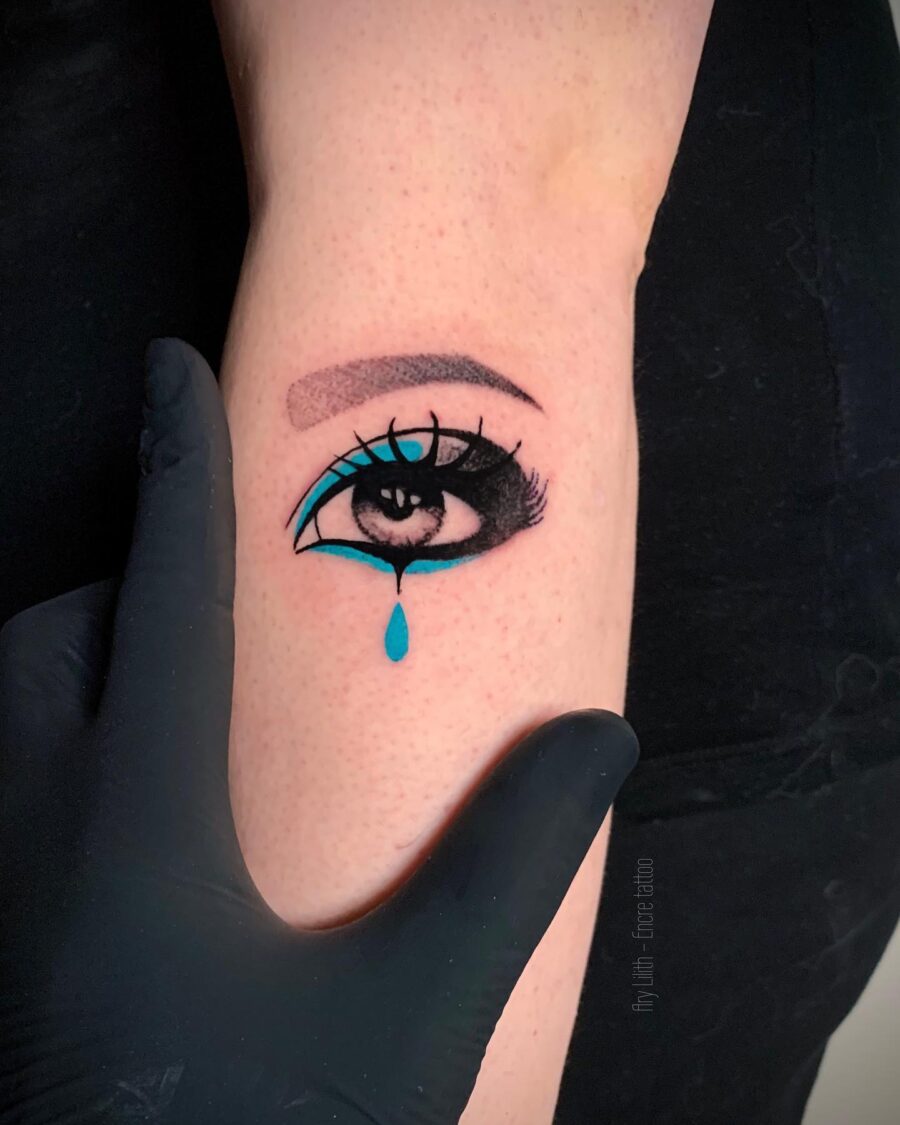 Expressive eye tattoo with vibrant details Tattoo on skin