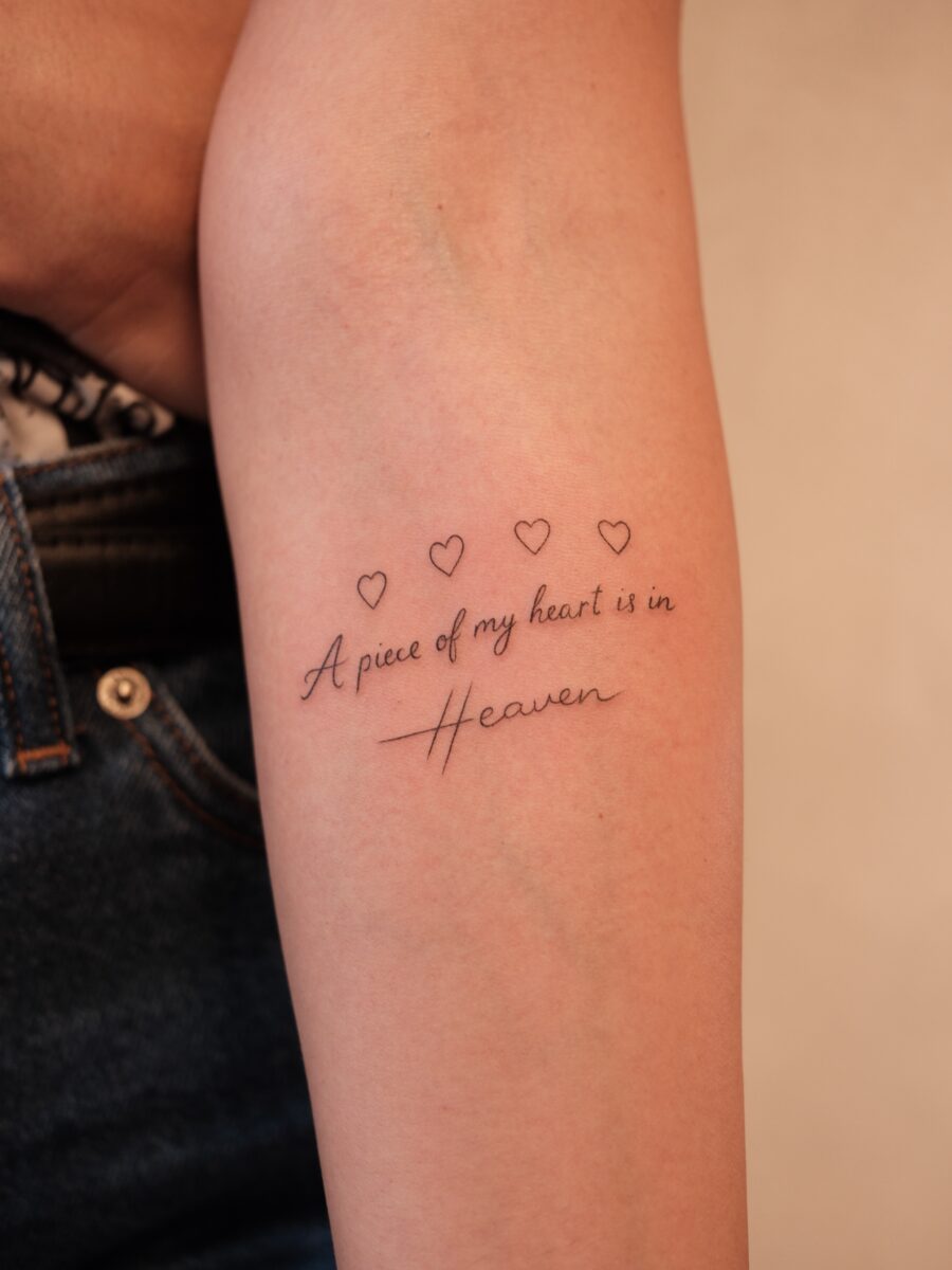 Heartfelt tribute with elegant script tattoo Tattoo on skin