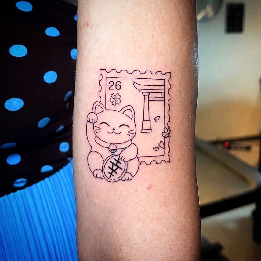 Charming Japanese cat tattoo with postage design Tattoo on skin