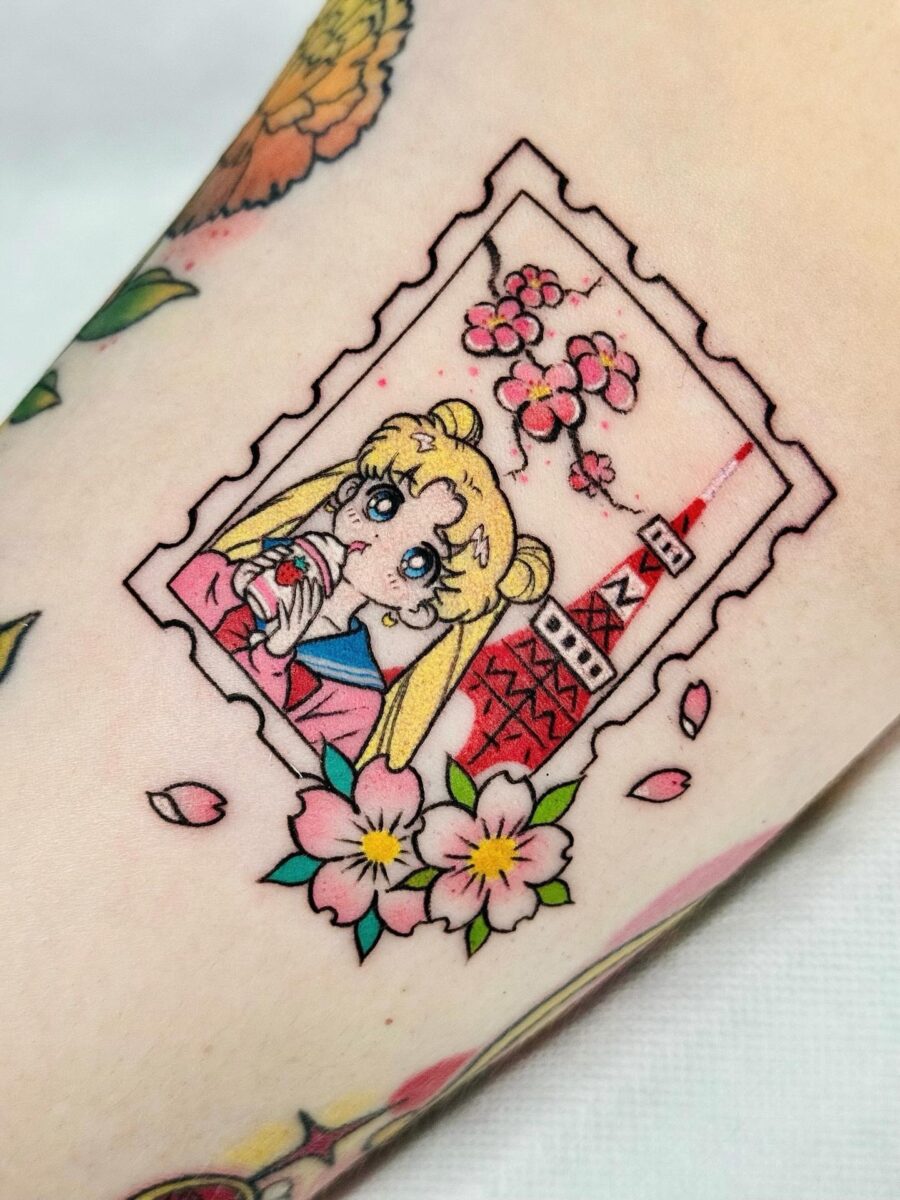 Charming Sailor Moon Tattoo with Sakura Elements Tattoo on skin