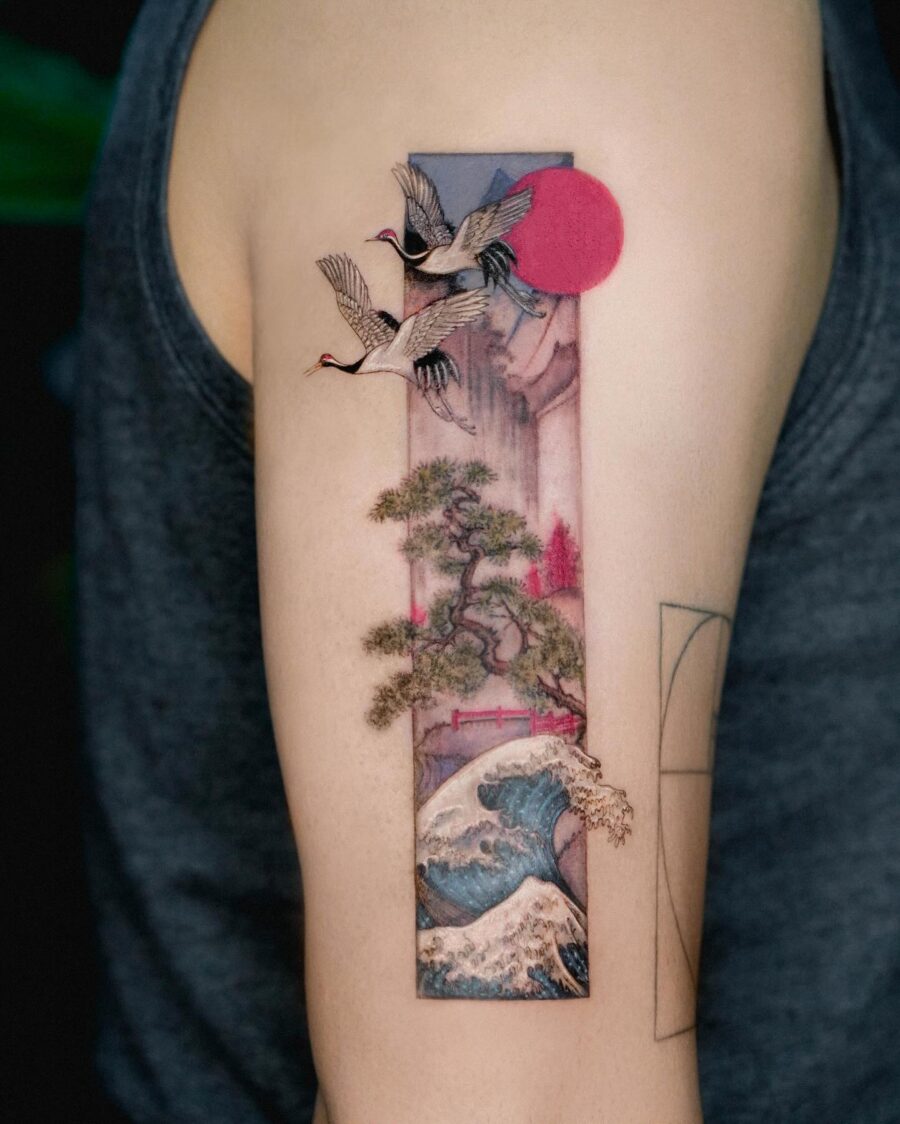 Elegant Japanese tattoo featuring cranes and waves Tattoo on skin