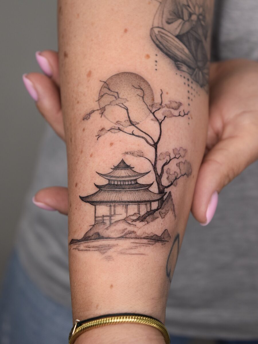 Elegant Japanese temple with serene surroundings Tattoo on skin
