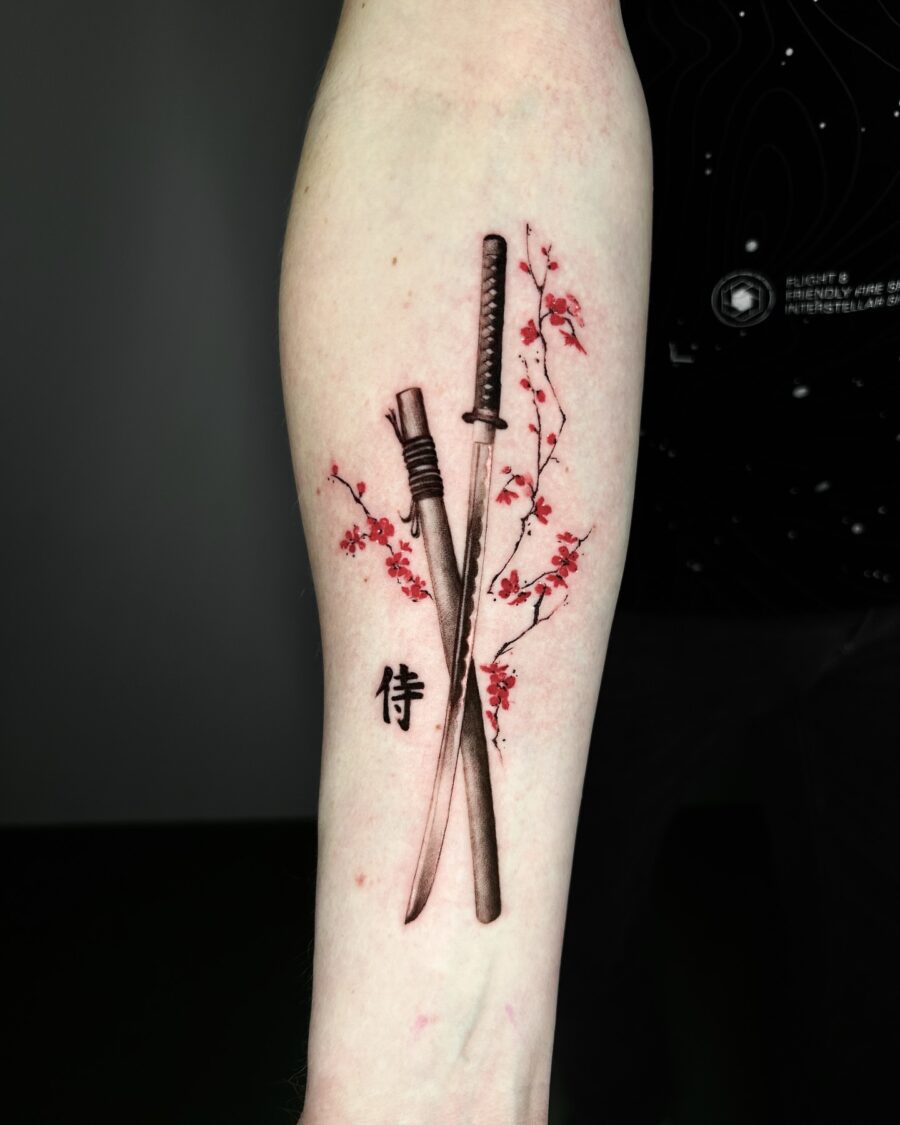 Intricate samurai swords with delicate cherry blossoms Tattoo on skin