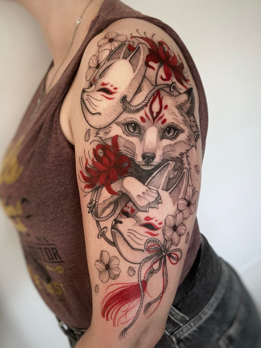 Stunning Japanese Fox Mask Tattoo with Flowers Tattoo on skin
