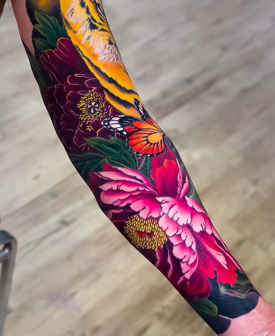 Stunning Japanese tattoo showcasing vivid flowers Tattoo on skin