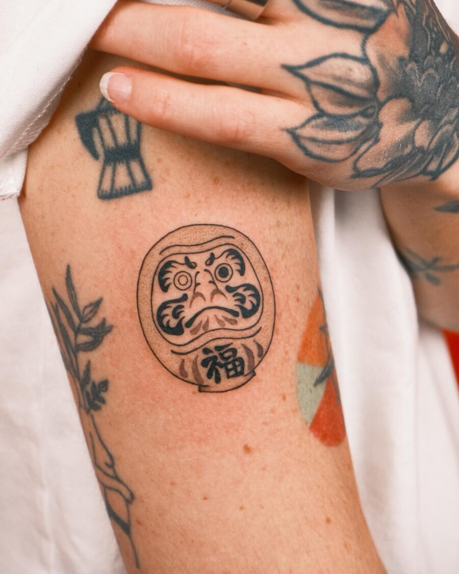 Symbolic Daruma Tattoo Artwork on Skin Tattoo on skin