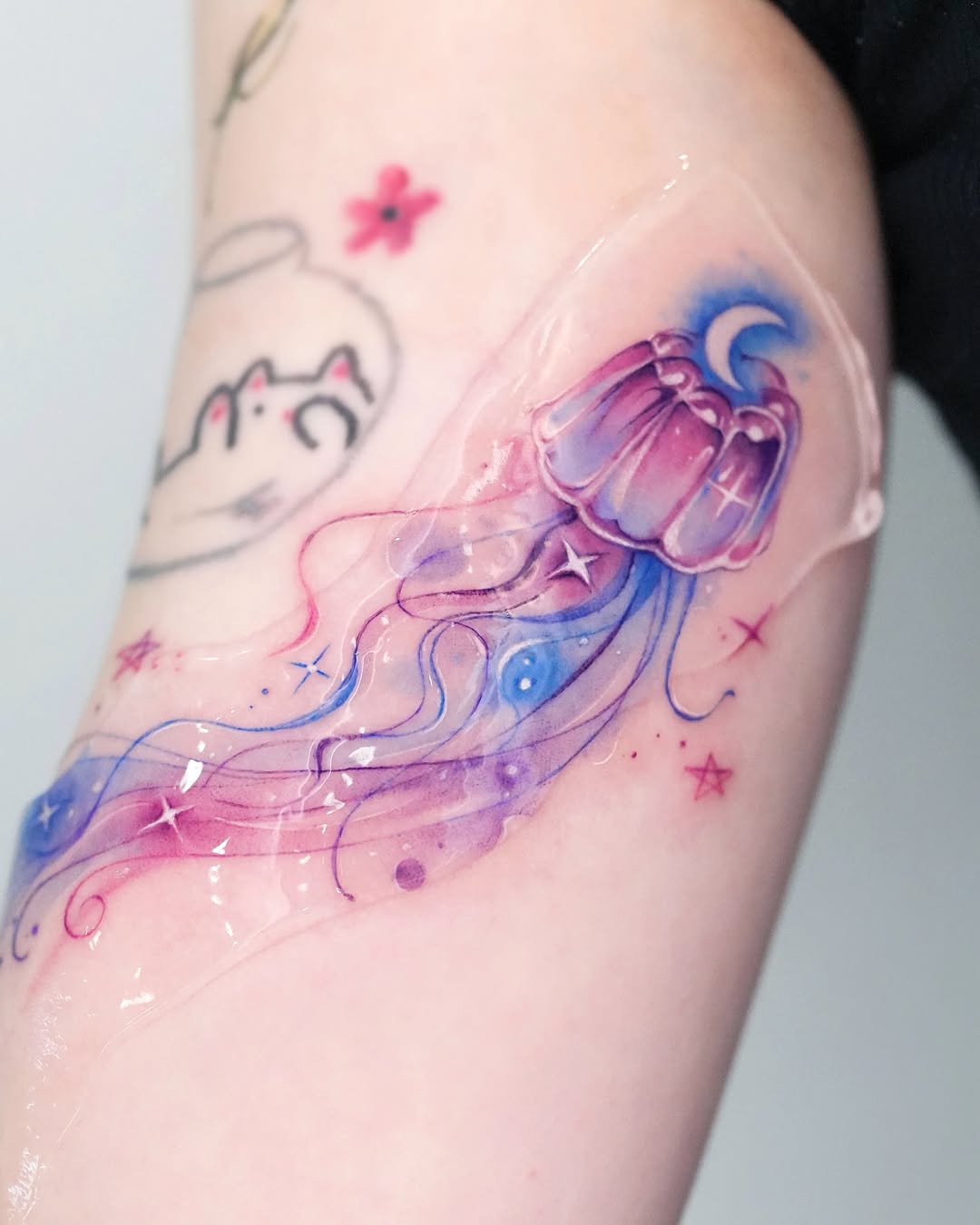 Colorful jellyfish tattoo with dreamy vibes Tattoo on skin
