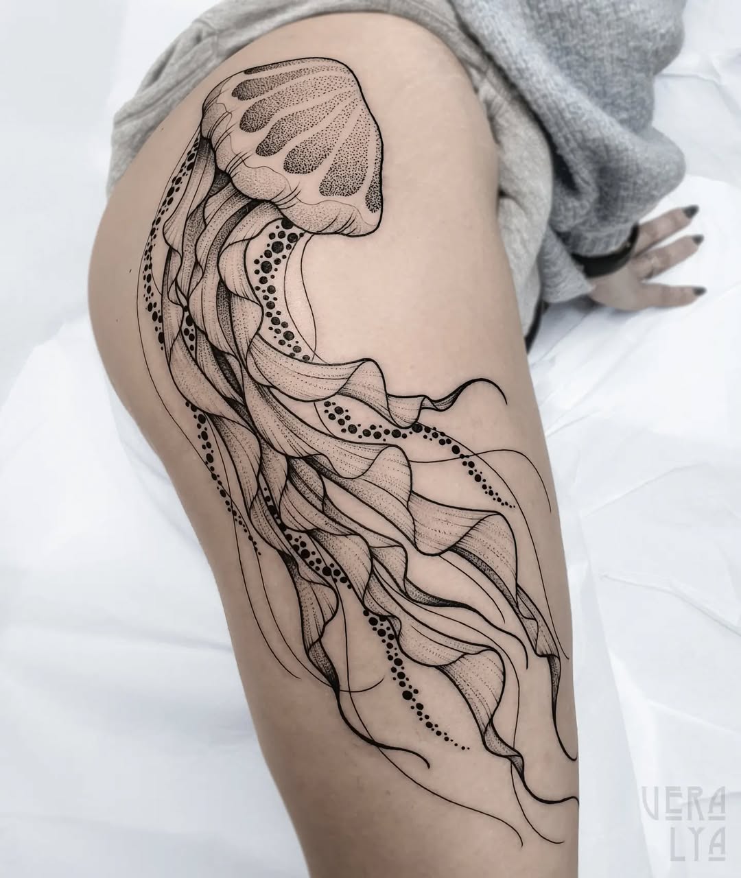 Elegant jellyfish tattoo featuring intricate line work Tattoo on skin