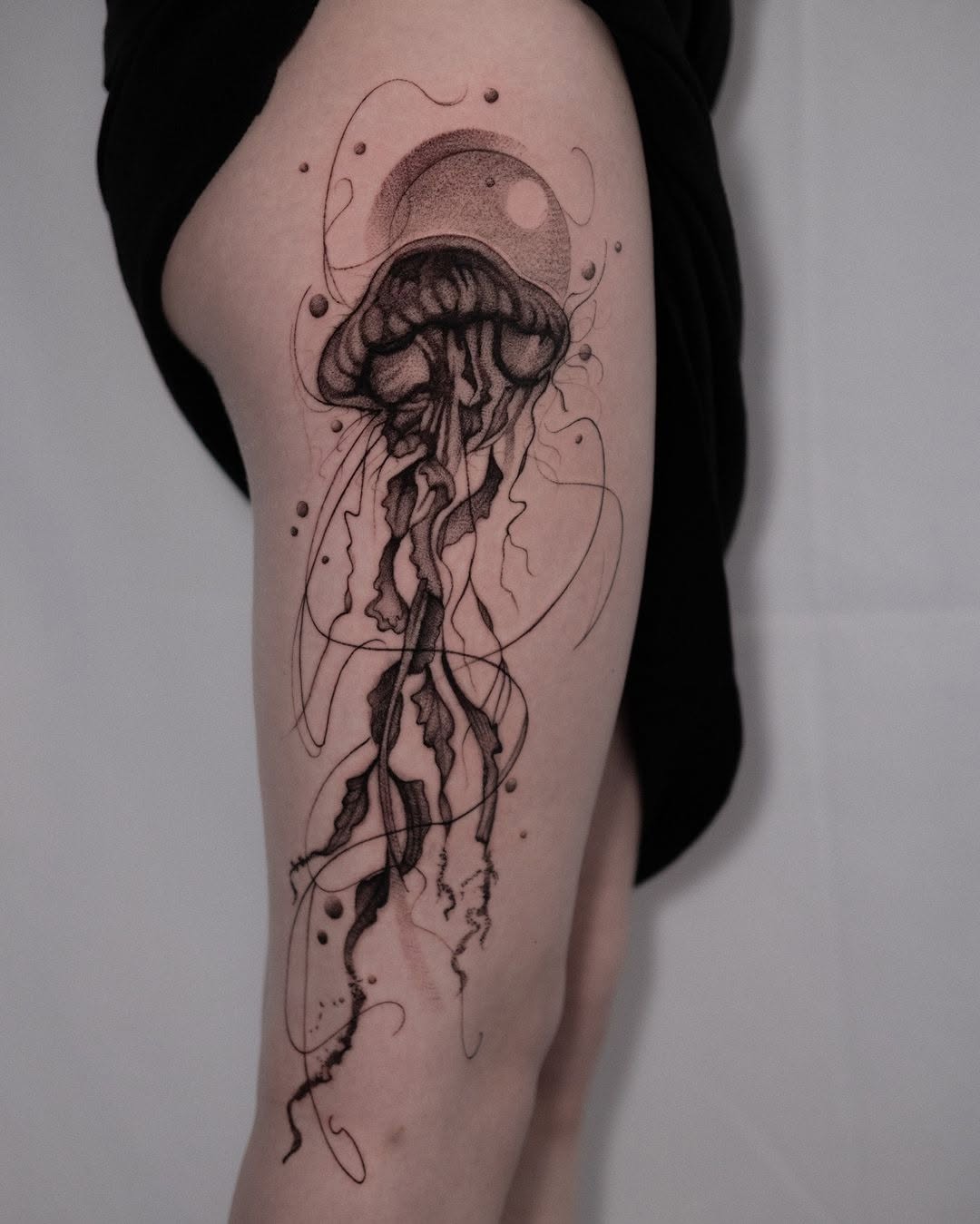 Elegant jellyfish tattoo flowing with grace Tattoo on skin