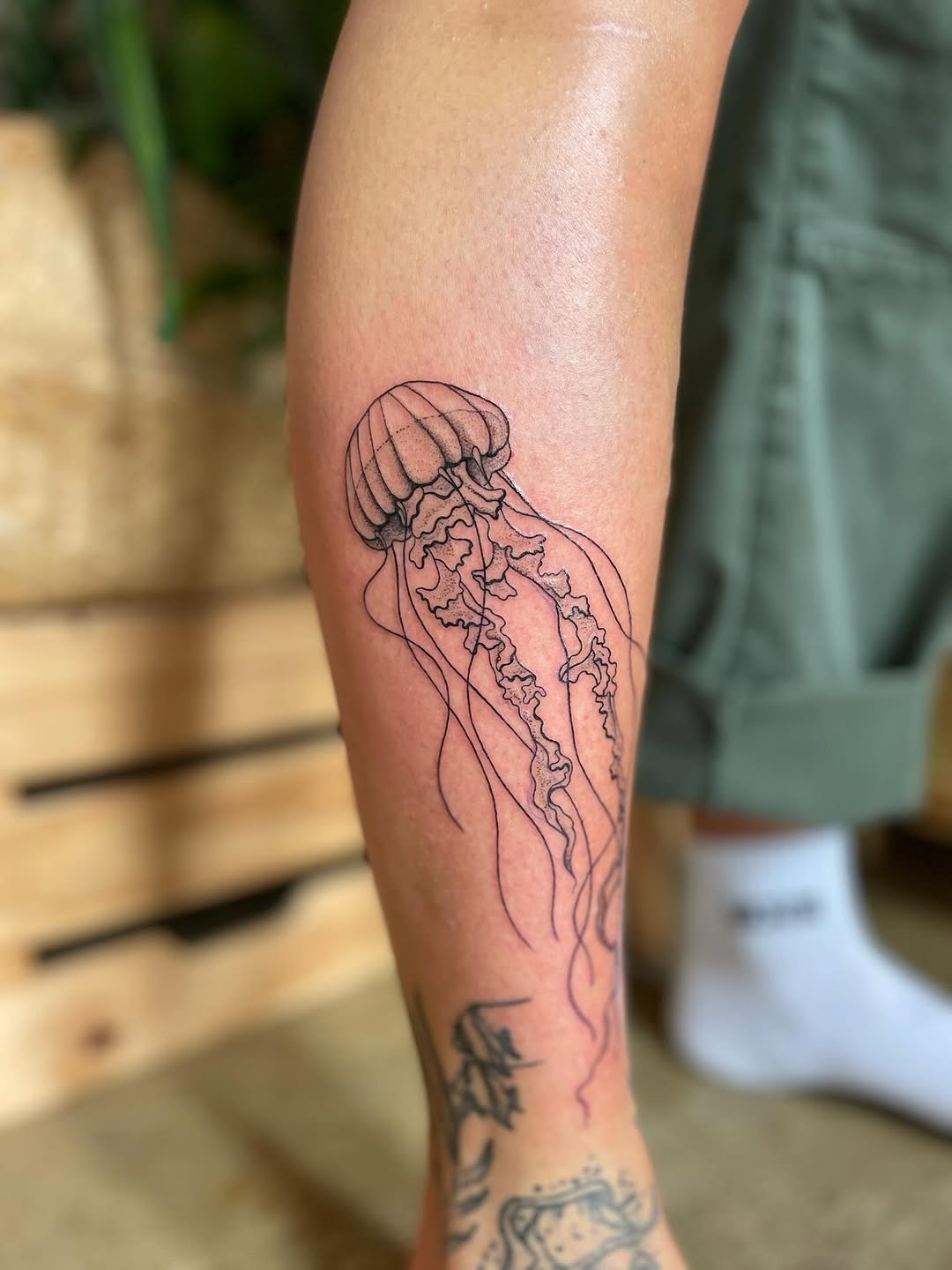 Elegant jellyfish tattoo showcasing minimalist design Tattoo on skin