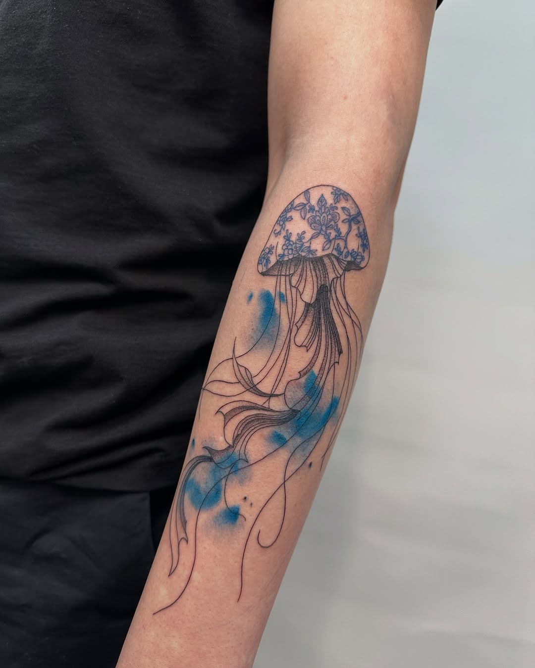 Elegant jellyfish tattoo with flowing effects Tattoo on skin