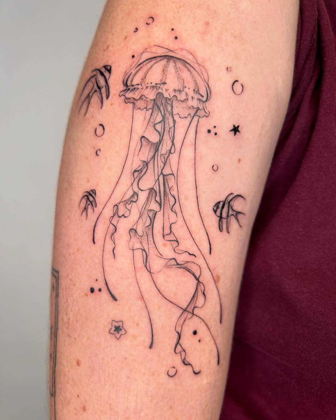Elegant jellyfish tattoo with flowing tentacles Tattoo on skin