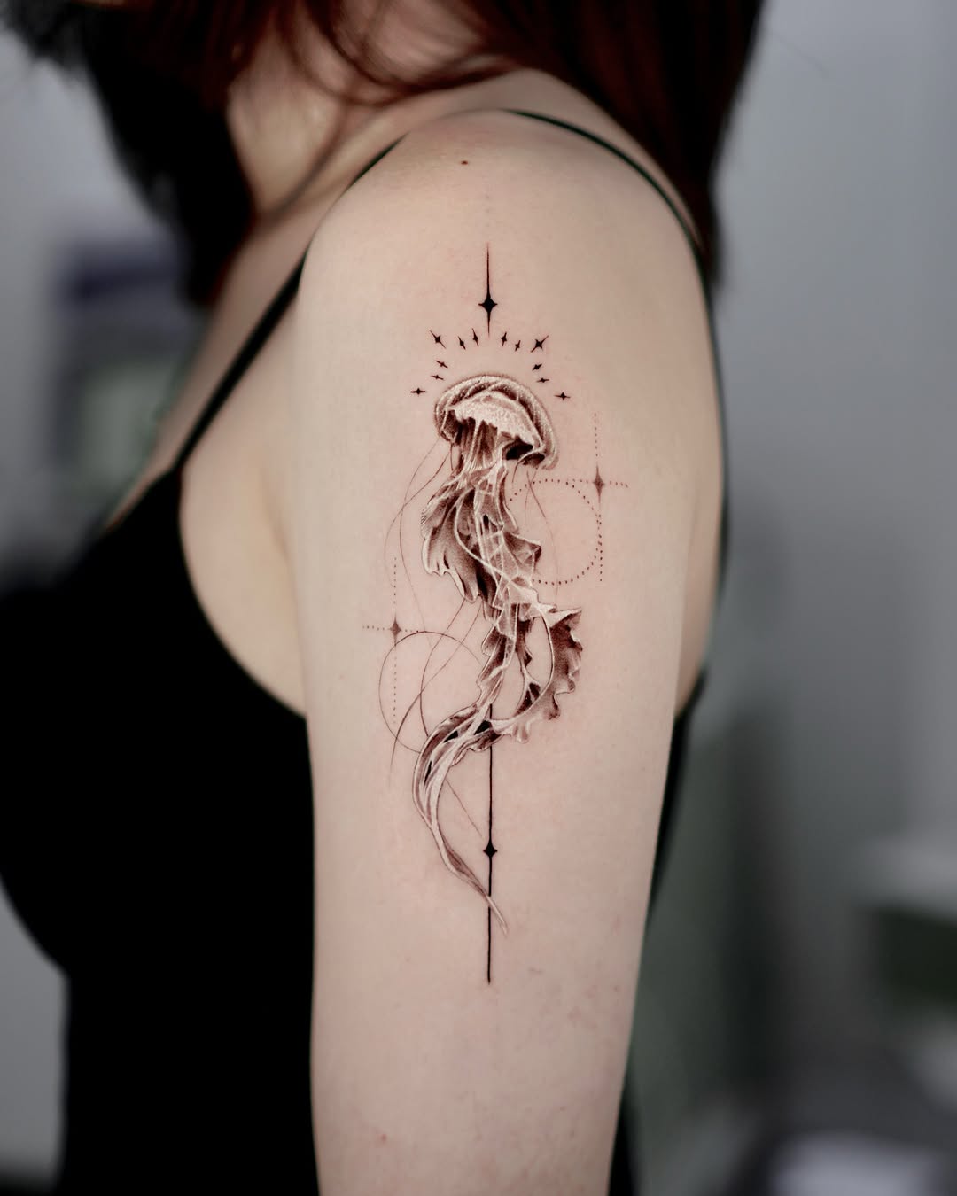 Elegant jellyfish tattoo with geometric accents Tattoo on skin