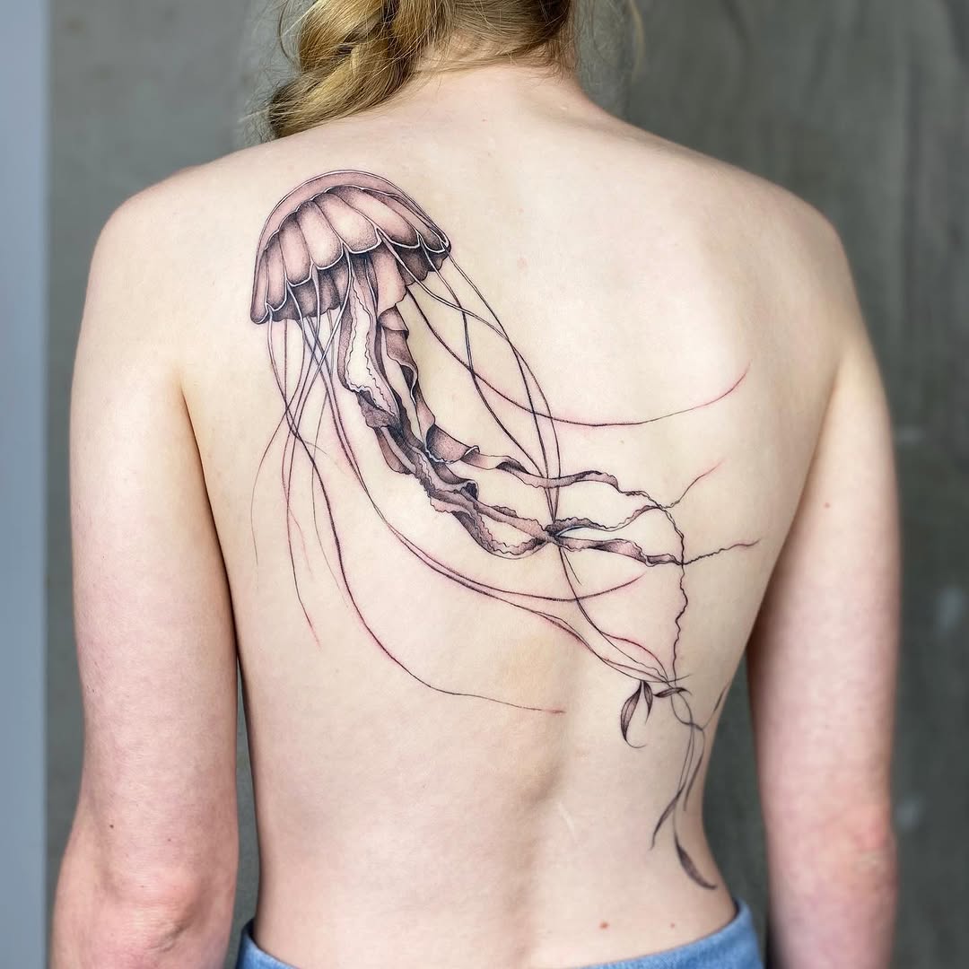 Graceful jellyfish tattoo design on the back Tattoo on skin