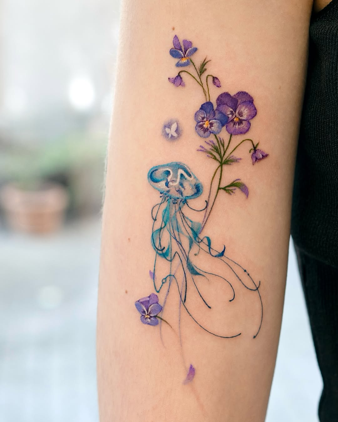 Intricate jellyfish and floral tattoo design Tattoo on skin