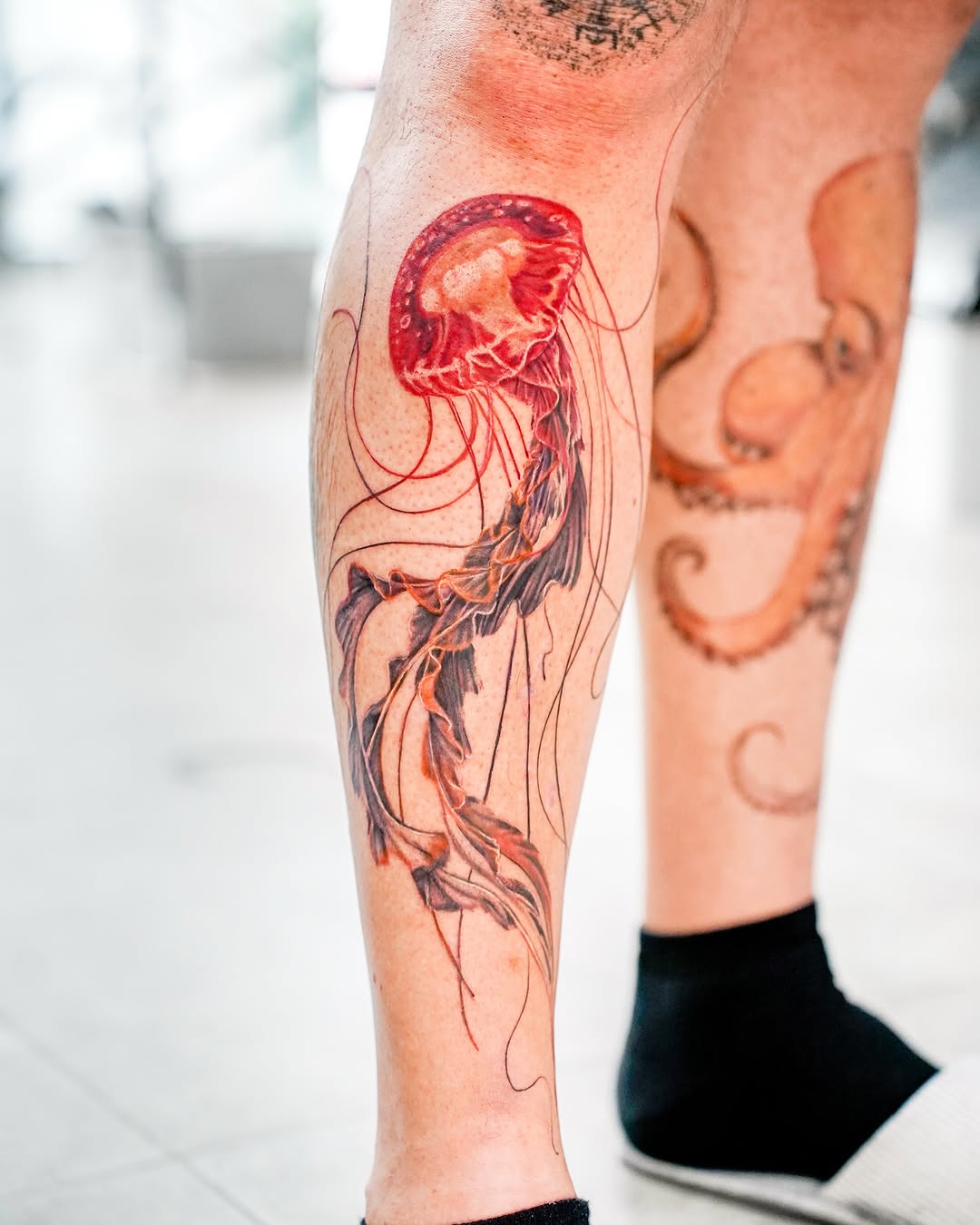 Stunning jellyfish tattoo showcasing vibrant colors Tattoo on skin
