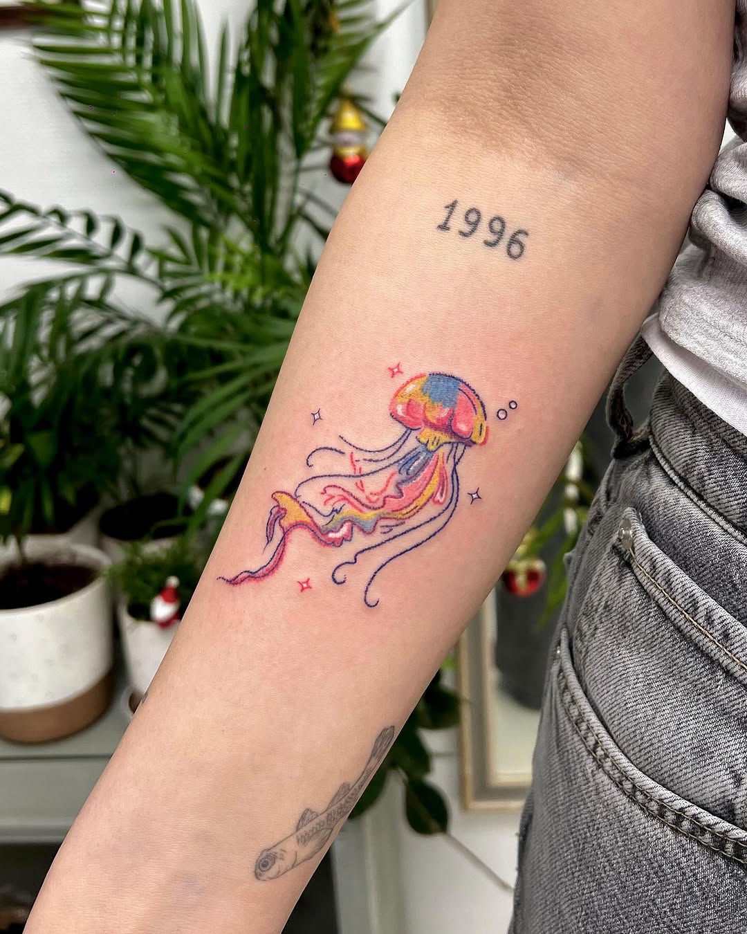 Vibrant jellyfish tattoo with playful details Tattoo on skin