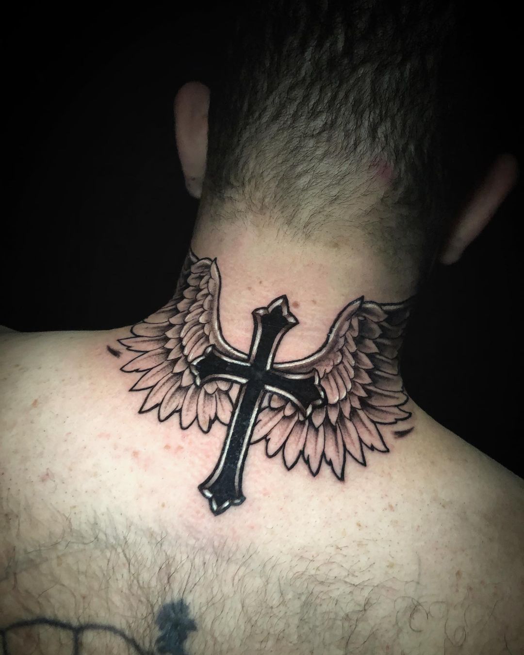 Beautiful Black and Silver Cross Tattoo with Angel Wings Tattoo on skin