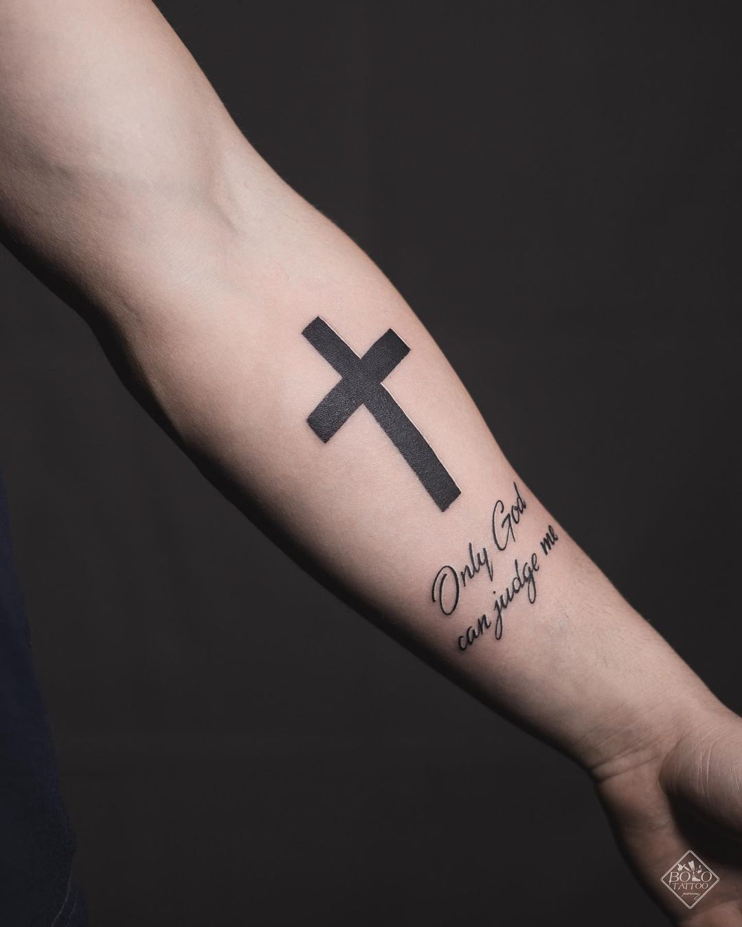 Black Cross Tattoo with “Only God can Judge Me” Tattoo on skin