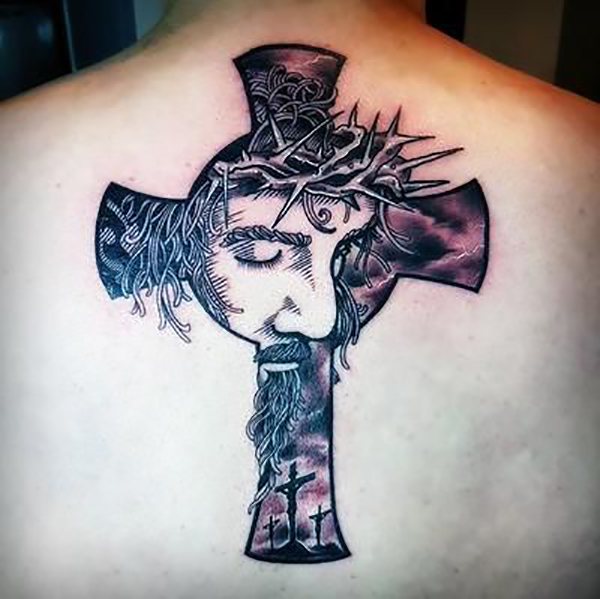 Celtic Cross Tattoo with a Portrait of Jesus and the Crosses of Calvary jesus cross tattoos