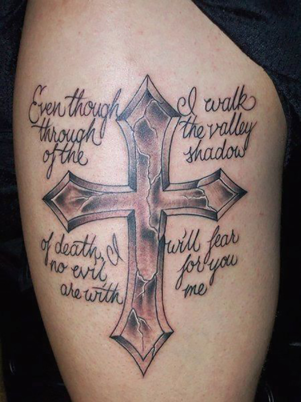 Cracked Pointed Cross Tattoo with a Bible Verse Tattoo on skin