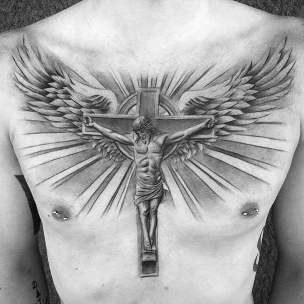 Grey Crucifix on a Celtic Cross Tattoo with Wings Tattoo on skin