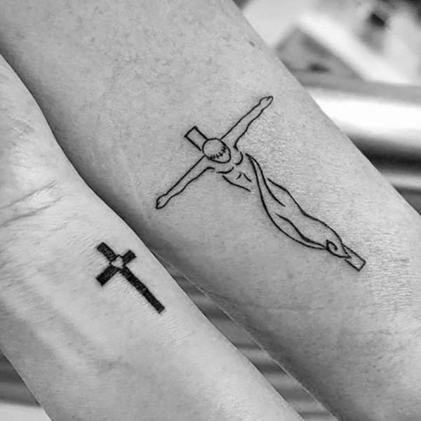 His and Hers Simple Forearm Cross Tattoos Tattoo on skin
