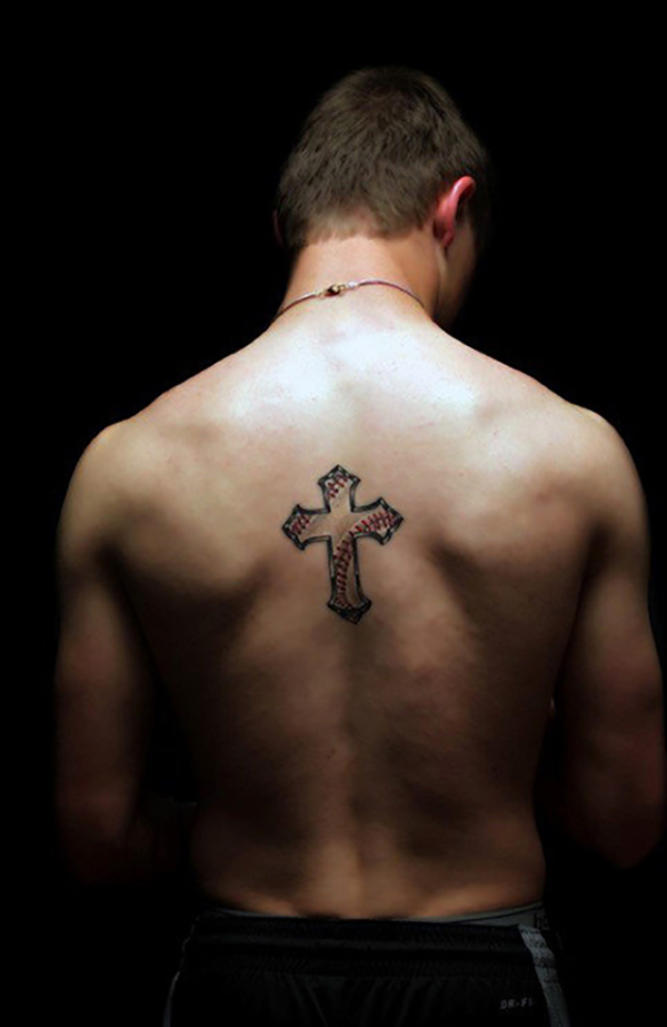 Pointed Celtic Cross Tattoo with Baseball Stitching Tattoo on skin