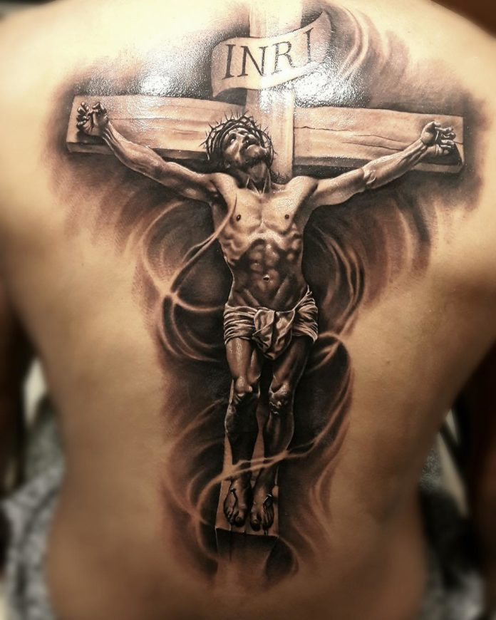 Powerful Tattoo of Jesus on the Cross Tattoo in Vintage Brown Tattoo on skin