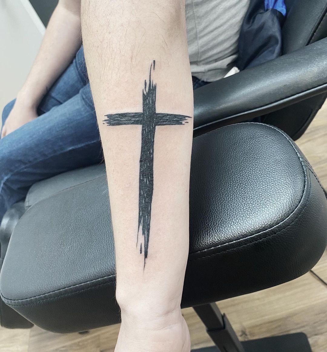 Rugged and Simple Faded Cross Tattoo Tattoo on skin