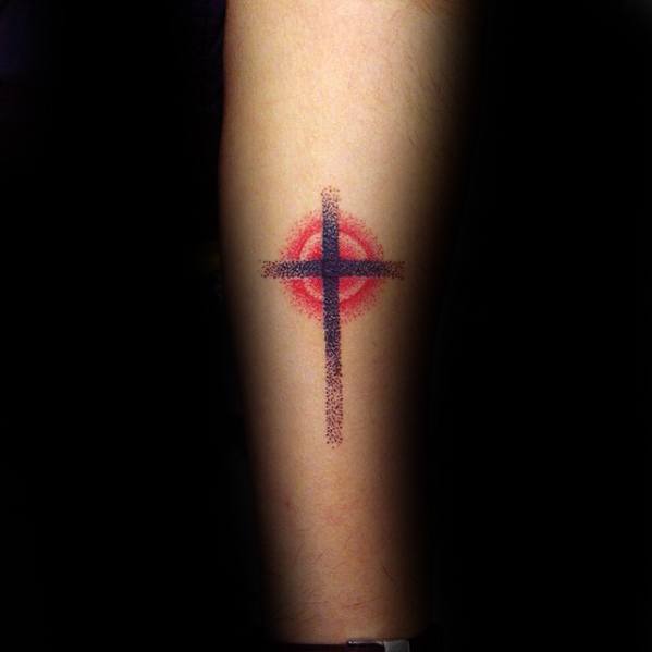Simple Faded Cross Tattoo with a Red Circular Background Tattoo on skin