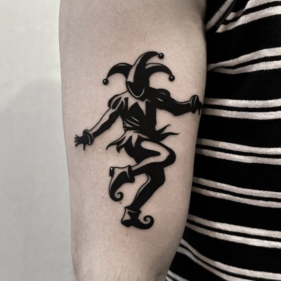 Classic Joker Jester Tattoo in Bold Black Tattoo on skin
