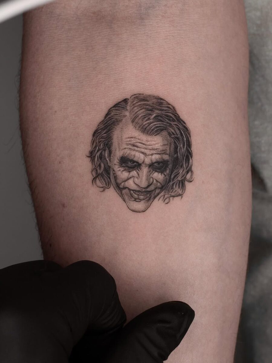 Detailed Joker tattoo capturing his iconic grin Tattoo on skin