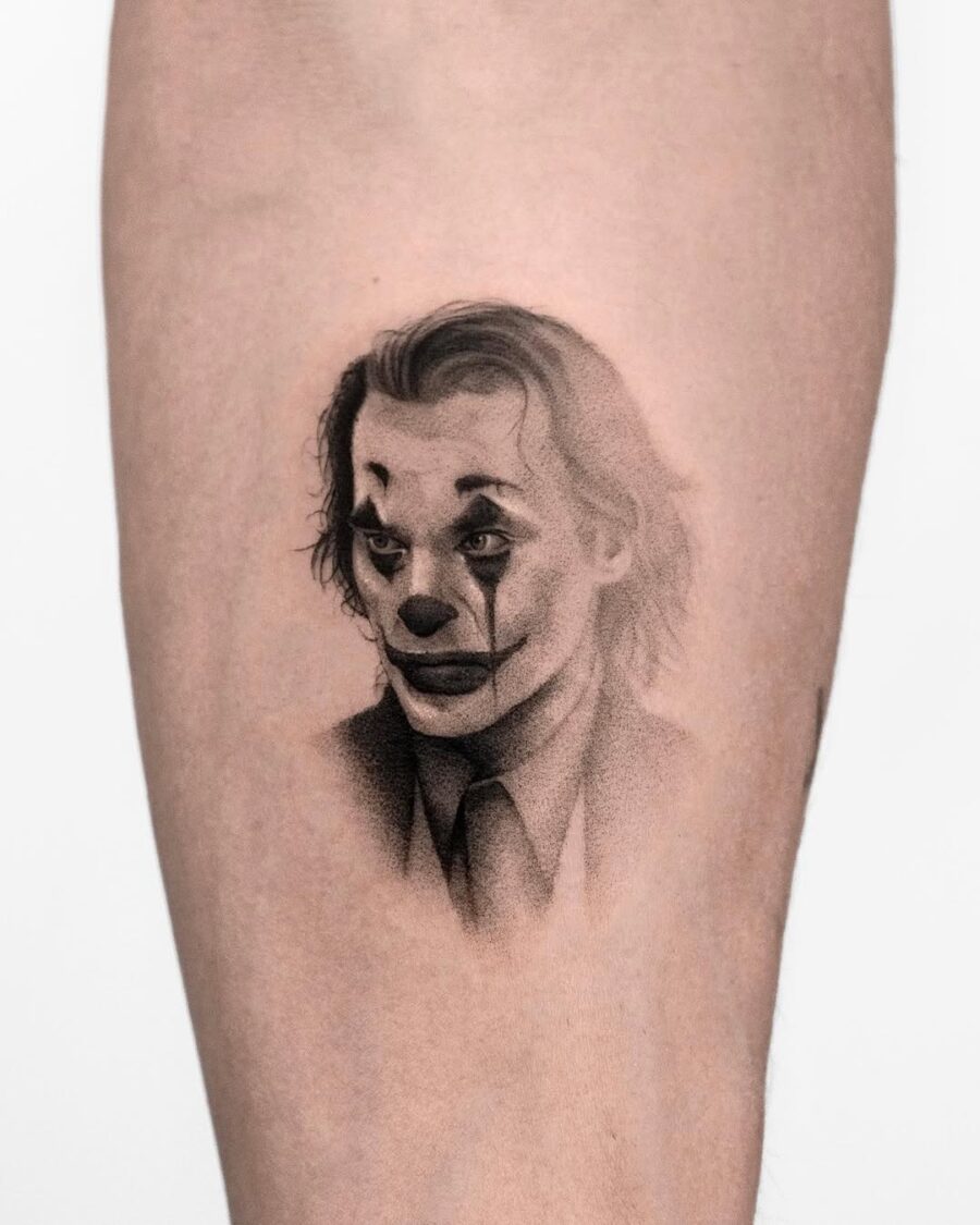 Intricate Joker Tattoo with Emo Facial Expression Tattoo on skin
