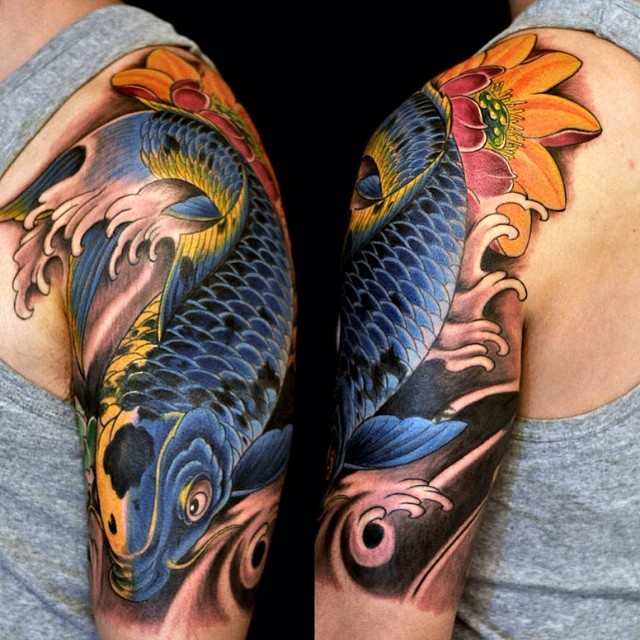 Blue and Black Koi with Gold Tattoo on skin