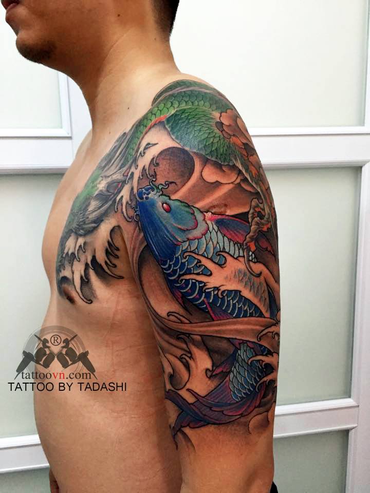 Blue Koi Swimming Upstream with Dragon Koi Fish Tattoos Tattoo on skin