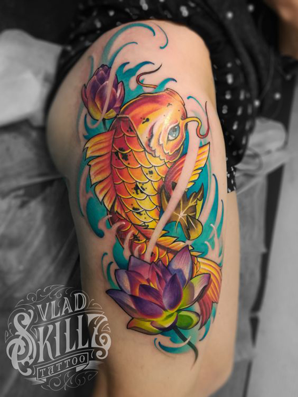 Golden Koi with Lotus Flowers Tattoo on skin