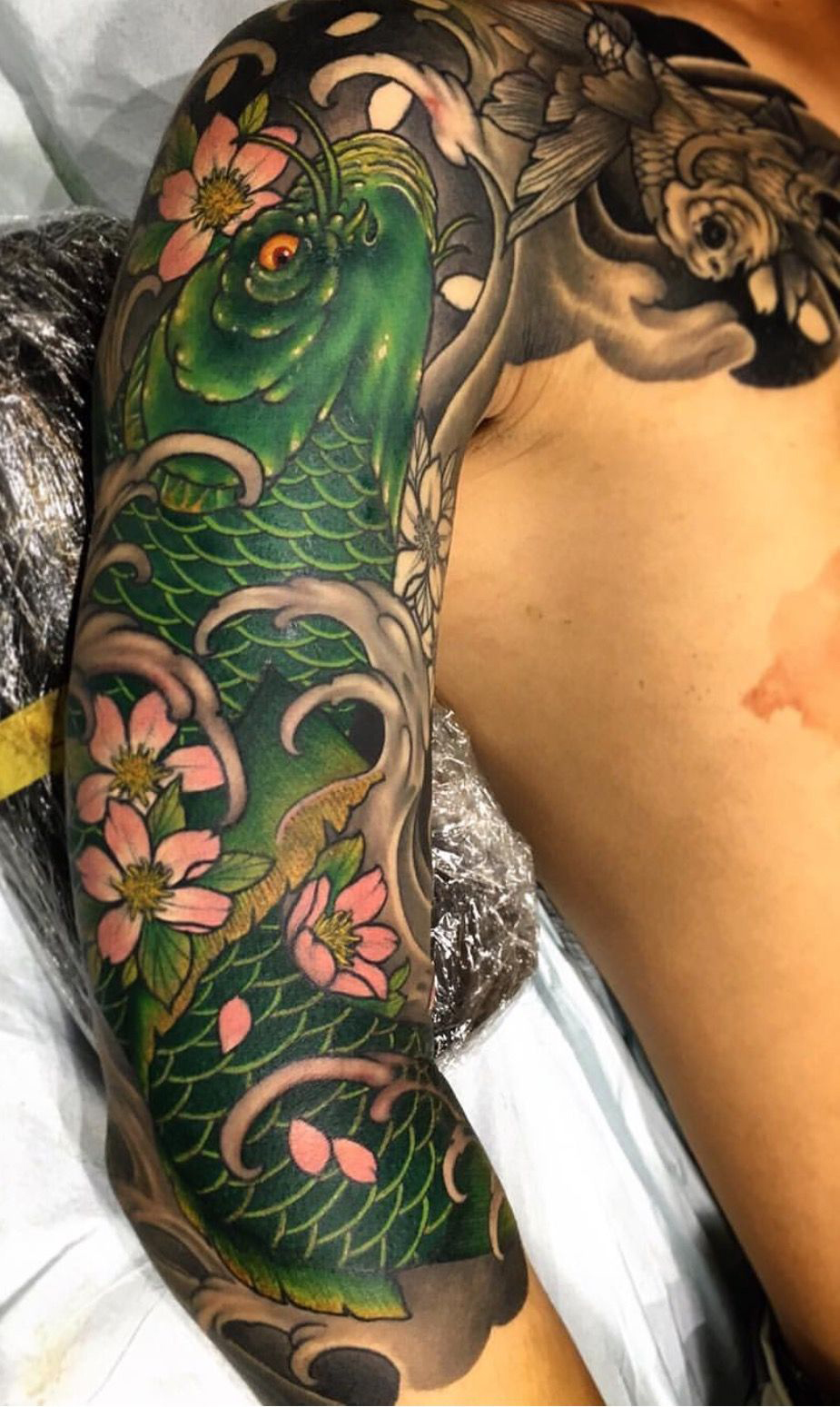Green Koi with Cherry Blossoms Fish Tattoos Tattoo on skin