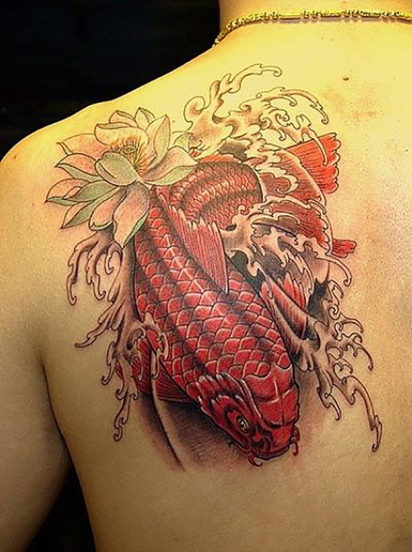 Red Koi Swimming Downstream with Lotus Koi Tattoo Tattoo on skin