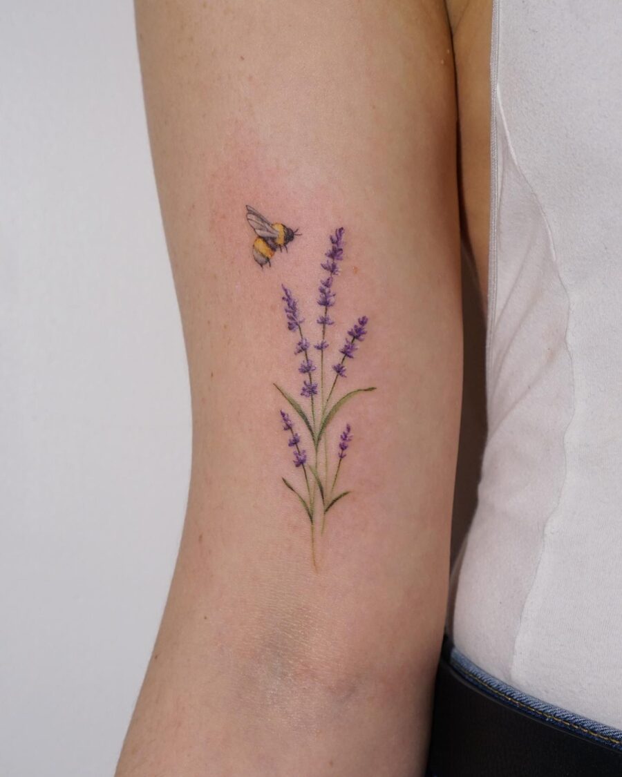 Delicate lavender and bee tattoo design Tattoo on skin