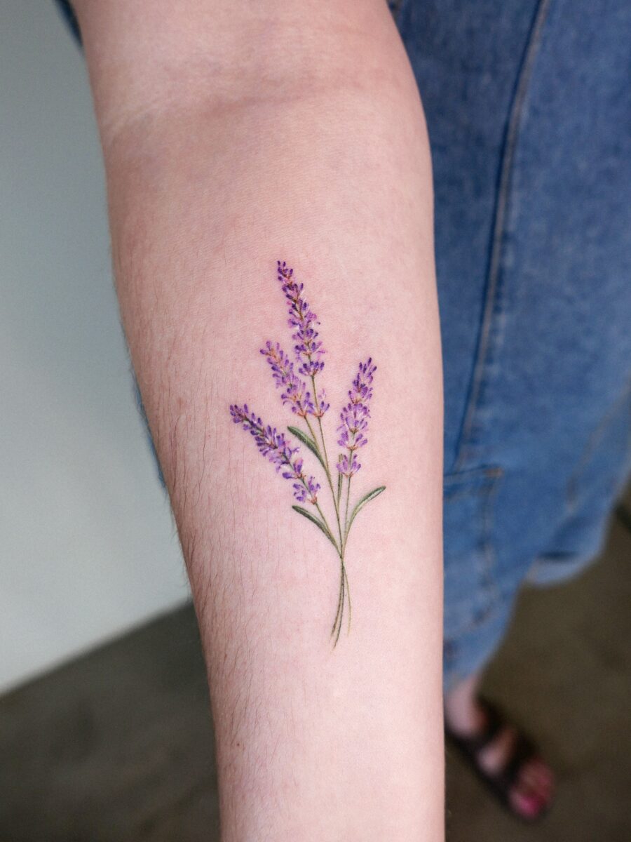 Delicate lavender tattoo on forearm Tattoo on skin