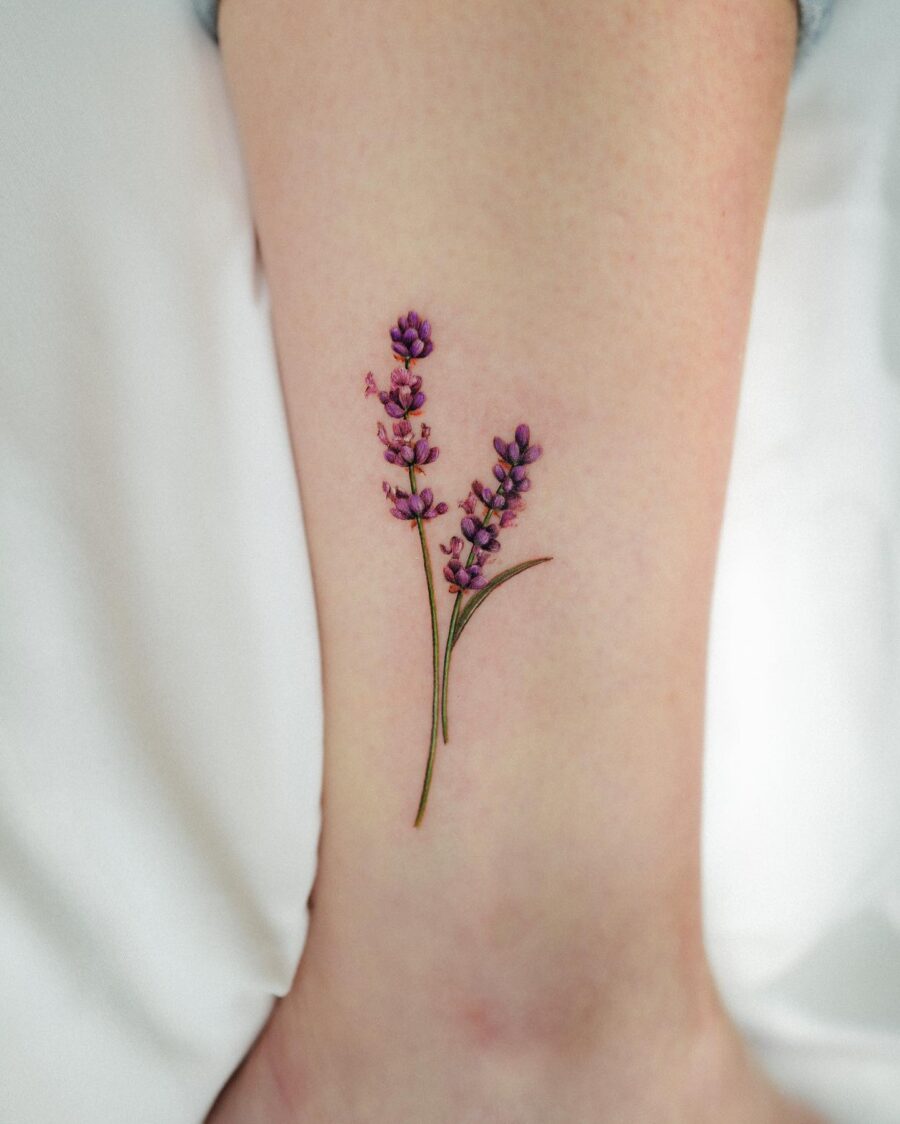Delicate lavender tattoo on the leg Tattoo on skin