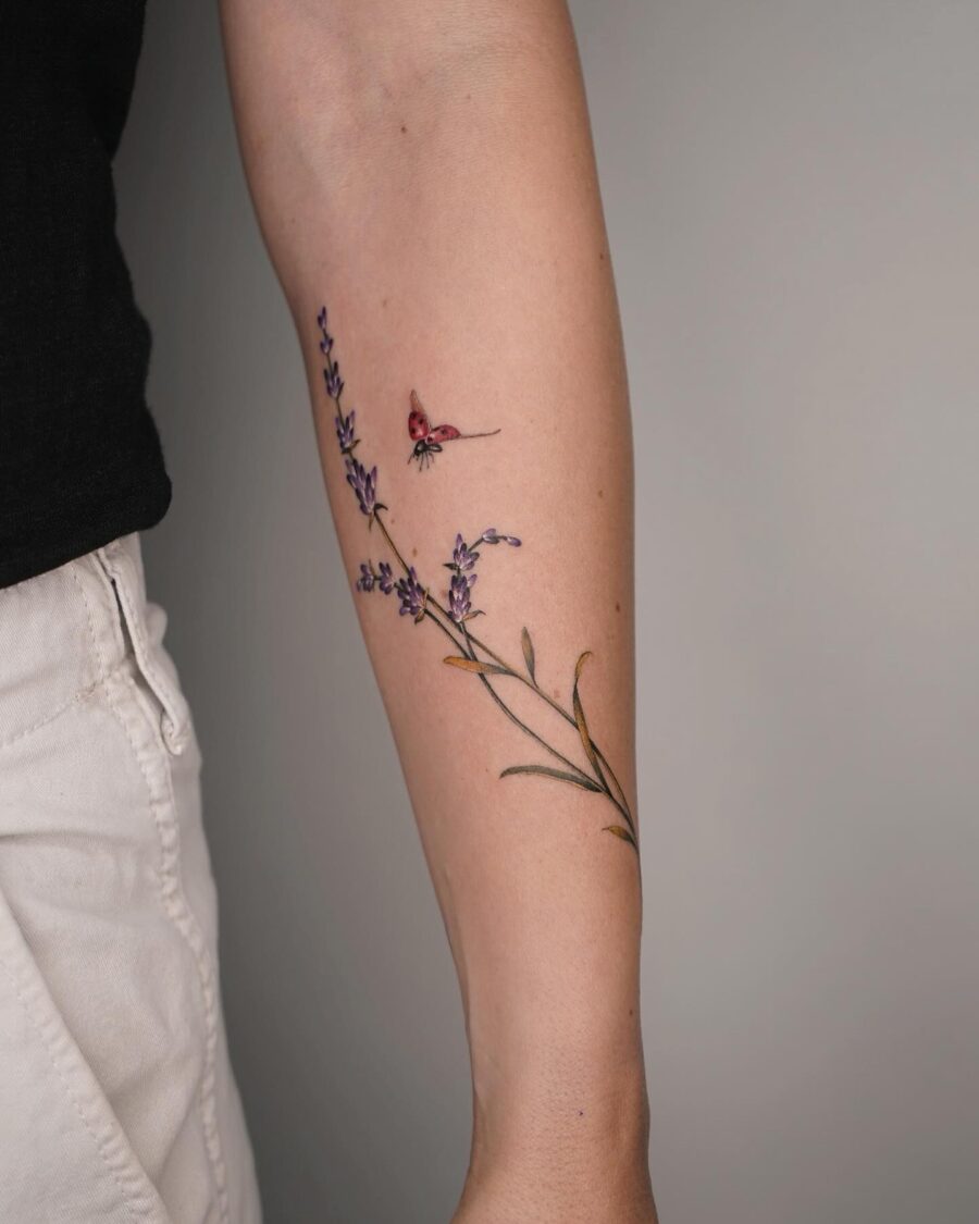 Delicate lavender tattoo with a butterfly accent Tattoo on skin