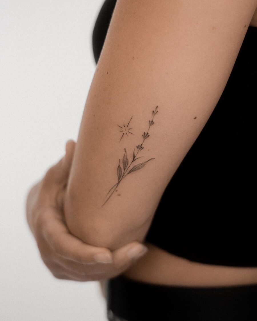 Elegant lavender tattoo with a delicate star. Tattoo on skin