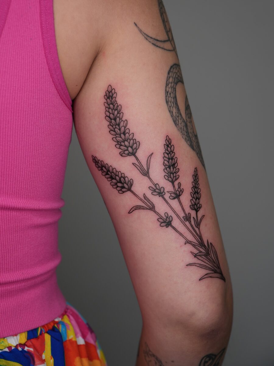 Elegant lavender tattoo with intricate details Tattoo on skin