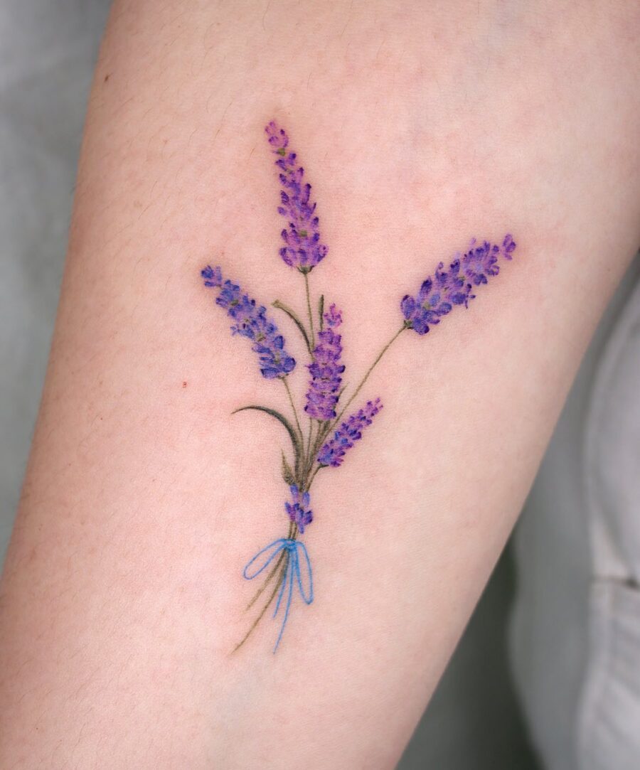 Stunning lavender tattoo bouquet with blue ribbon Tattoo on skin