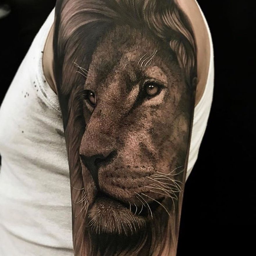 Lion Tattoo Ideas: Realism Style Lion Head Tattoo in Grayscale Tattoo on skin