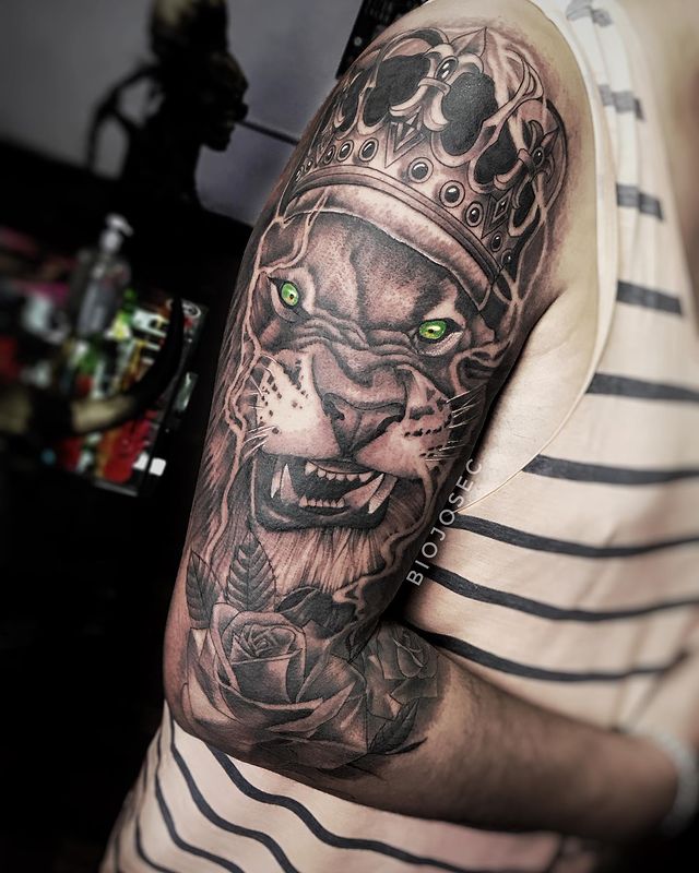 Lion Tattoos Idea: Green Eyed Lion with Crown Tattoo, Lion Eyes Tattoo Tattoo on skin